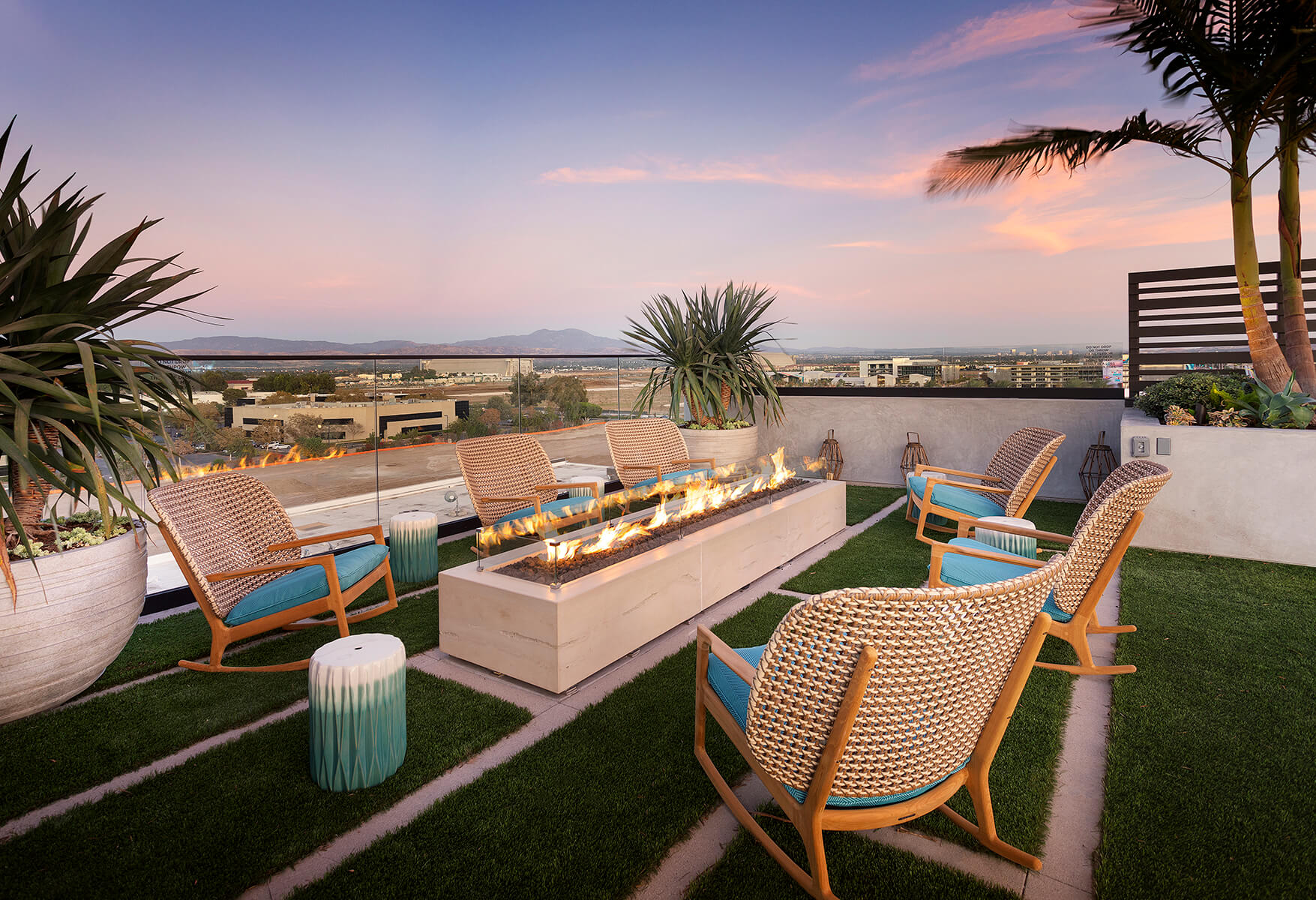 rooftop fire pit and rocking chairs with sunset views of irvine