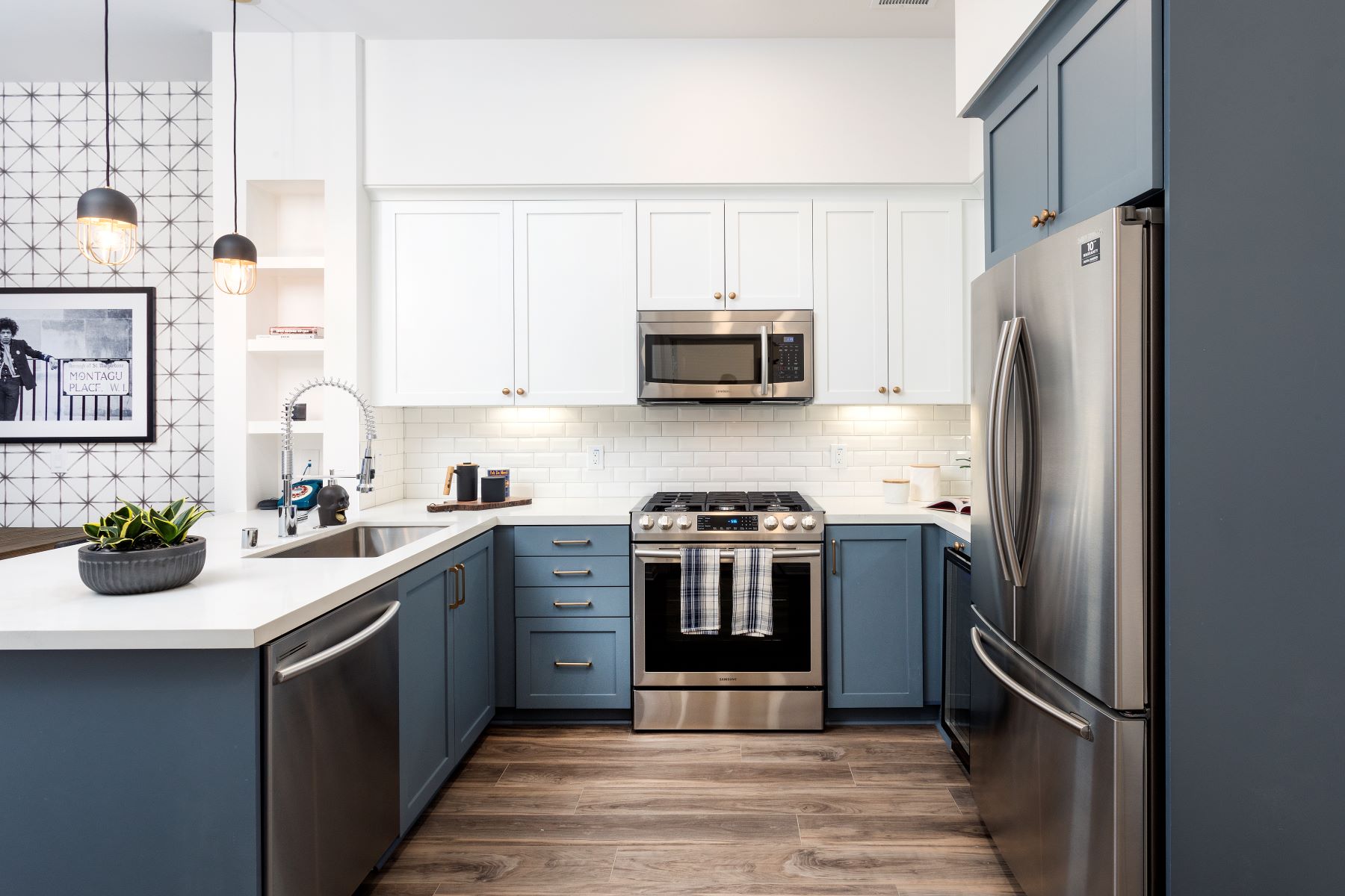 blue and white kitchen with large peninsula counter at broadstone arden apartments